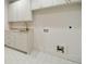 Laundry room with washer and dryer hookups and storage cabinets at 3006 Skyland Ne Dr, Brookhaven, GA 30319