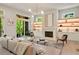 Bright living room featuring a fireplace, built-ins, and access to the outdoor deck at 3006 Skyland Ne Dr, Brookhaven, GA 30319