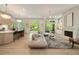 Open concept living room and kitchen with modern design and access to the outdoor space at 3006 Skyland Ne Dr, Brookhaven, GA 30319