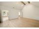 Spacious primary bedroom with vaulted ceiling, hardwood floors, and ensuite bath with natural light at 3006 Skyland Ne Dr, Brookhaven, GA 30319