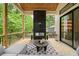 Covered porch with a dark fireplace, a comfortable seating area and a view of the backyard at 3006 Skyland Ne Dr, Brookhaven, GA 30319