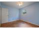 Empty bedroom featuring blue walls and a window at 34 Duke Dr, Lawrenceville, GA 30046