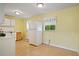 Functional kitchen with white appliances, cabinets, and a tiled floor at 34 Duke Dr, Lawrenceville, GA 30046