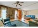 Cozy living room featuring a stone fireplace and warm, inviting decor at 34 Duke Dr, Lawrenceville, GA 30046