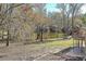 Expansive backyard with pond views, ideal for outdoor relaxation and entertaining at 574 Oak Grove Rd, Temple, GA 30179