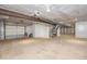 This unfinished basement has high ceilings, exposed ductwork, and is awaiting your personalization at 574 Oak Grove Rd, Temple, GA 30179
