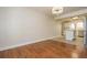 Dining room with hardwood floors that flows into a kitchen area with stainless steel appliances at 574 Oak Grove Rd, Temple, GA 30179