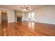 Bright living room with hardwood floors, fireplace and french doors that opens to a screened in porch at 574 Oak Grove Rd, Temple, GA 30179