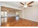 Open living room area with hardwood floors, recessed lighting, and french doors to a screened in porch at 574 Oak Grove Rd, Temple, GA 30179