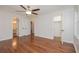 Main bedroom with hardwood floors, ceiling fan, large closet and a ensuite bath at 574 Oak Grove Rd, Temple, GA 30179