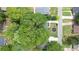 Aerial view of a home with lush, mature trees surrounding the landscaped yard at 957 Sharon Se Cir, Smyrna, GA 30080
