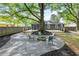 Backyard features a fire pit with chairs and a shed at 957 Sharon Se Cir, Smyrna, GA 30080