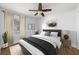 Cozy bedroom with neutral decor, hardwood floors, and a ceiling fan at 957 Sharon Se Cir, Smyrna, GA 30080