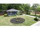 Beautiful home with a well-manicured lawn, landscaped front yard, and a long driveway at 957 Sharon Se Cir, Smyrna, GA 30080