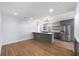 Bright, modern kitchen with gray cabinetry, stainless steel appliances, and a marble countertop island at 957 Sharon Se Cir, Smyrna, GA 30080