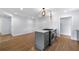 Bright kitchen showcasing a marble island with a modern gas range and stainless steel appliances at 957 Sharon Se Cir, Smyrna, GA 30080