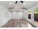 Bright living room features hardwood floors, vaulted ceiling, and access to the backyard via french doors at 957 Sharon Se Cir, Smyrna, GA 30080