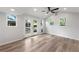 Bright living room features hardwood floors, vaulted ceiling, and access to the backyard via french doors at 957 Sharon Se Cir, Smyrna, GA 30080