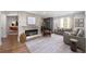 Bright living room with a fireplace and neutral decor, showcasing hardwood floors at 957 Sharon Se Cir, Smyrna, GA 30080