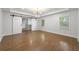 A bright bedroom with a tray ceiling, hardwood floors, walk-in closet, and natural light at 957 Sharon Se Cir, Smyrna, GA 30080