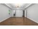 A light-filled main bedroom features a tray ceiling, wood floors, closet, and ensuite bathroom at 957 Sharon Se Cir, Smyrna, GA 30080