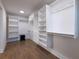 Spacious walk-in closet with custom shelving, drawers, and ample storage space at 957 Sharon Se Cir, Smyrna, GA 30080