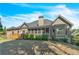 Landscaped backyard featuring a screened porch, deck and expansive lawn, creating a perfect retreat at 147 Gold Bridge Xing, Canton, GA 30114