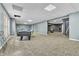Open finished basement offers a pool table and comfortable living area with lots of room to roam at 147 Gold Bridge Xing, Canton, GA 30114