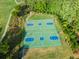 Aerial shot of the community's vibrant basketball court, surrounded by lush trees and walking trails at 147 Gold Bridge Xing, Canton, GA 30114