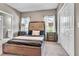 Bedroom with a large bed, wooden nightstands and large closet at 147 Gold Bridge Xing, Canton, GA 30114