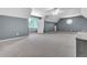 Expansive bonus room featuring neutral carpeting, updated ceiling fan and abundant natural light from bright window at 147 Gold Bridge Xing, Canton, GA 30114