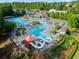 An aerial view of the community pool with slides, and a relaxing atmosphere at 147 Gold Bridge Xing, Canton, GA 30114