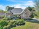 Charming home with stone accents, manicured landscaping, and a well-maintained lawn at 147 Gold Bridge Xing, Canton, GA 30114