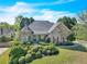 Charming home with stone accents, manicured landscaping, and a well-maintained lawn at 147 Gold Bridge Xing, Canton, GA 30114