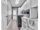 Functional laundry room with modern appliances and storage at 147 Gold Bridge Xing, Canton, GA 30114
