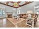 Cozy living room offers a fireplace, plush seating, and large windows for natural light at 147 Gold Bridge Xing, Canton, GA 30114
