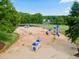 A playground with multiple structures, slides, and climbing areas surrounded by a safe, sandy surface at 147 Gold Bridge Xing, Canton, GA 30114