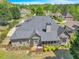 Spacious backyard featuring a deck, screened porch, and beautifully landscaped surroundings at 147 Gold Bridge Xing, Canton, GA 30114