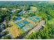 Aerial view of multiple tennis courts showcasing community recreational facilities and surrounding neighborhood at 147 Gold Bridge Xing, Canton, GA 30114