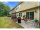 Backyard patio area with a grill and table next to the grass area at 2060 Ellison Nw Way # 11, Kennesaw, GA 30152