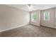 Neutral bedroom with carpeted flooring, natural light, and plenty of space at 2060 Ellison Nw Way # 11, Kennesaw, GA 30152