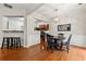 Dining area with hardwood floors, chandelier, and kitchen view at 2060 Ellison Nw Way # 11, Kennesaw, GA 30152