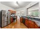 Modern kitchen featuring stainless steel appliances, granite countertops, and hardwood flooring at 2060 Ellison Nw Way # 11, Kennesaw, GA 30152
