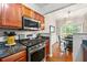 Modern kitchen with stainless steel appliances and a breakfast nook at 2060 Ellison Nw Way # 11, Kennesaw, GA 30152