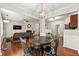 Open concept living and dining area with hardwood floors and a fireplace at 2060 Ellison Nw Way # 11, Kennesaw, GA 30152