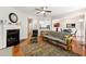 Spacious living room showcasing a fireplace, hardwood flooring, and open access to the kitchen and dining areas at 2060 Ellison Nw Way # 11, Kennesaw, GA 30152