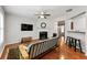 Open-concept living room with fireplace, hardwood floors, and a view into adjoining rooms at 2060 Ellison Nw Way # 11, Kennesaw, GA 30152