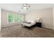 Comfortable main bedroom with carpeted flooring and ample natural light from multiple windows at 2060 Ellison Nw Way # 11, Kennesaw, GA 30152