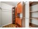 Organized walk-in closet with built-in shelving and ample storage space at 2060 Ellison Nw Way # 11, Kennesaw, GA 30152