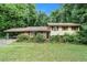 Charming single Gathering home with a nice front yard surrounded by mature trees at 2214 River Rd, Ellenwood, GA 30294